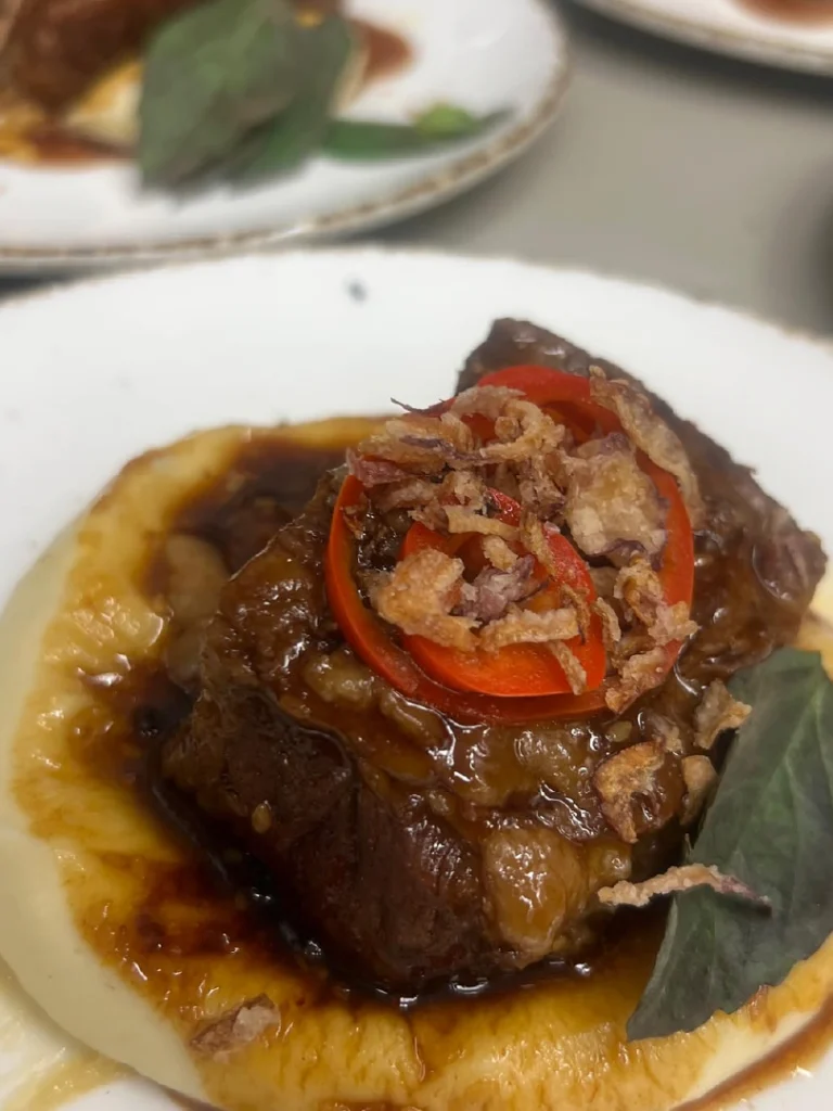 Braised Beef with Crispy Onions prepared as a Jetfinity catering selection