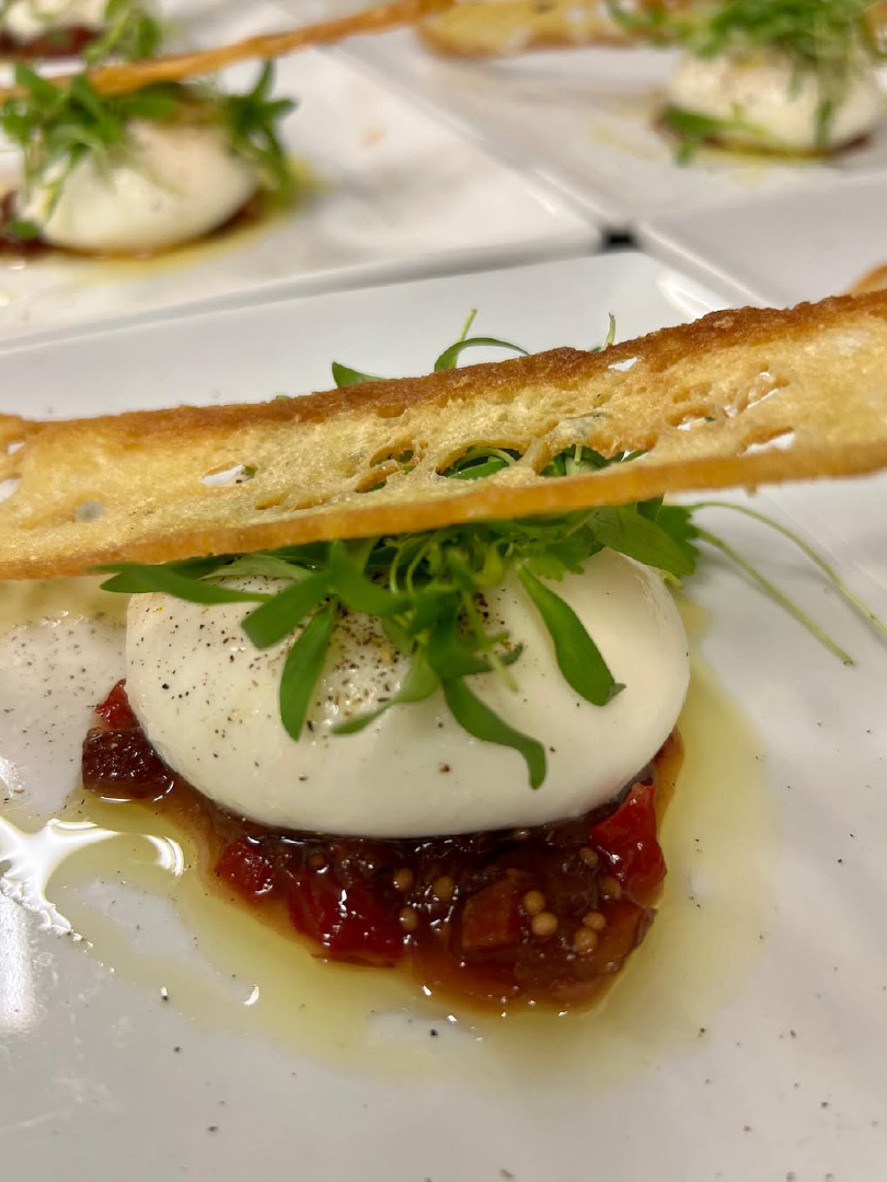 Burrata Appetizer with Crisp Bread prepared as a Jetfinity catering selection
