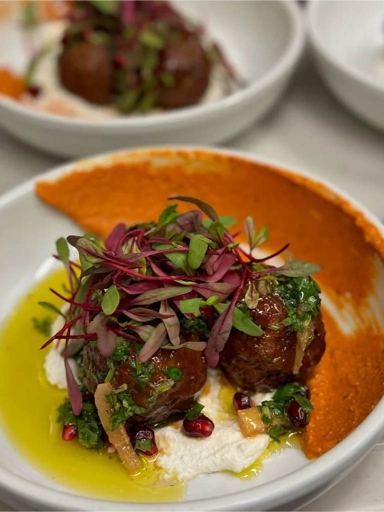 Meatballs with Red Pepper Sauce and Herbs prepared as a Jetfinity catering selection