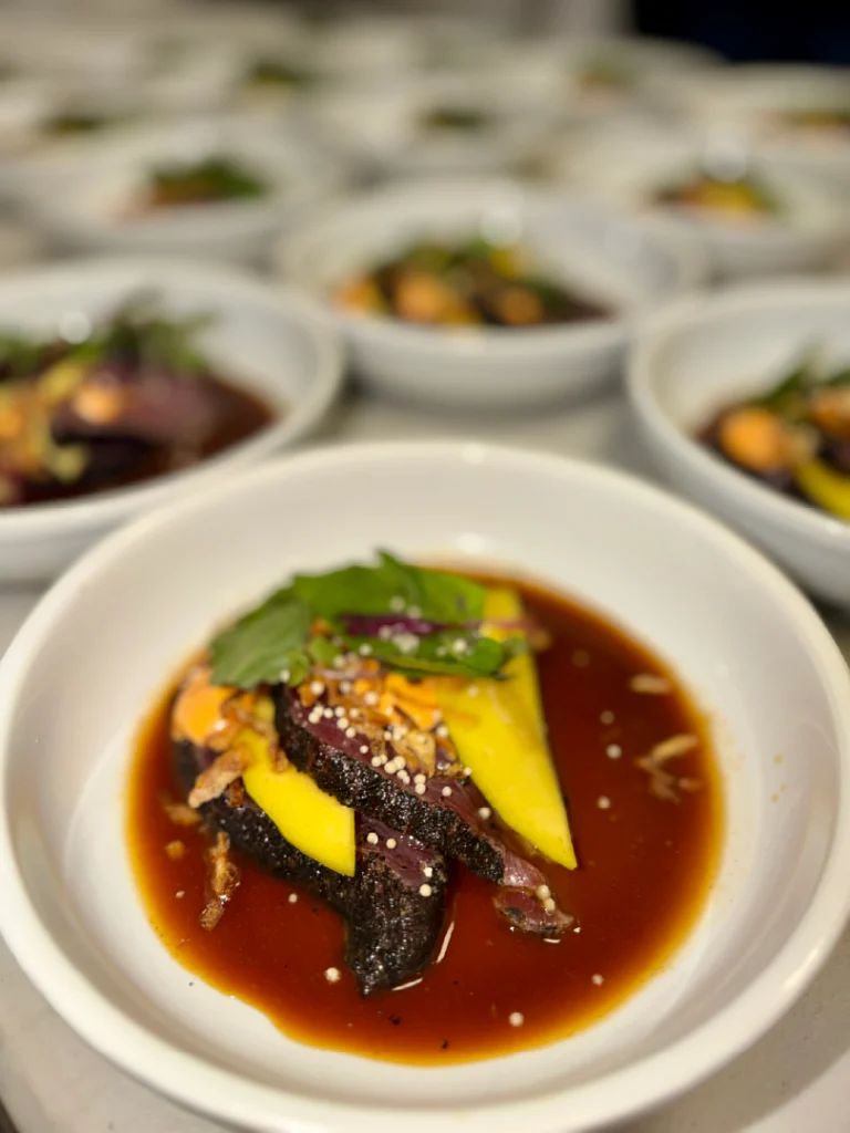 Plated Entree with Avocado and Sauce prepared as a Jetfinity catering selection