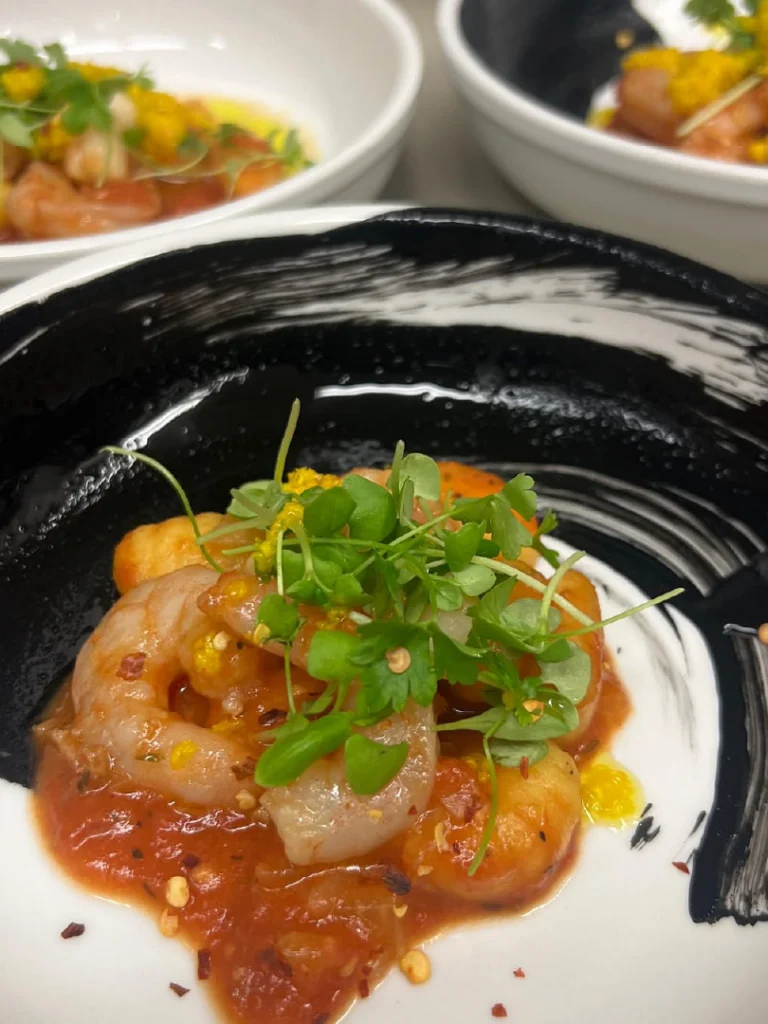 Shrimp Appetizer with Tomato Sauce prepared as a Jetfinity catering selection