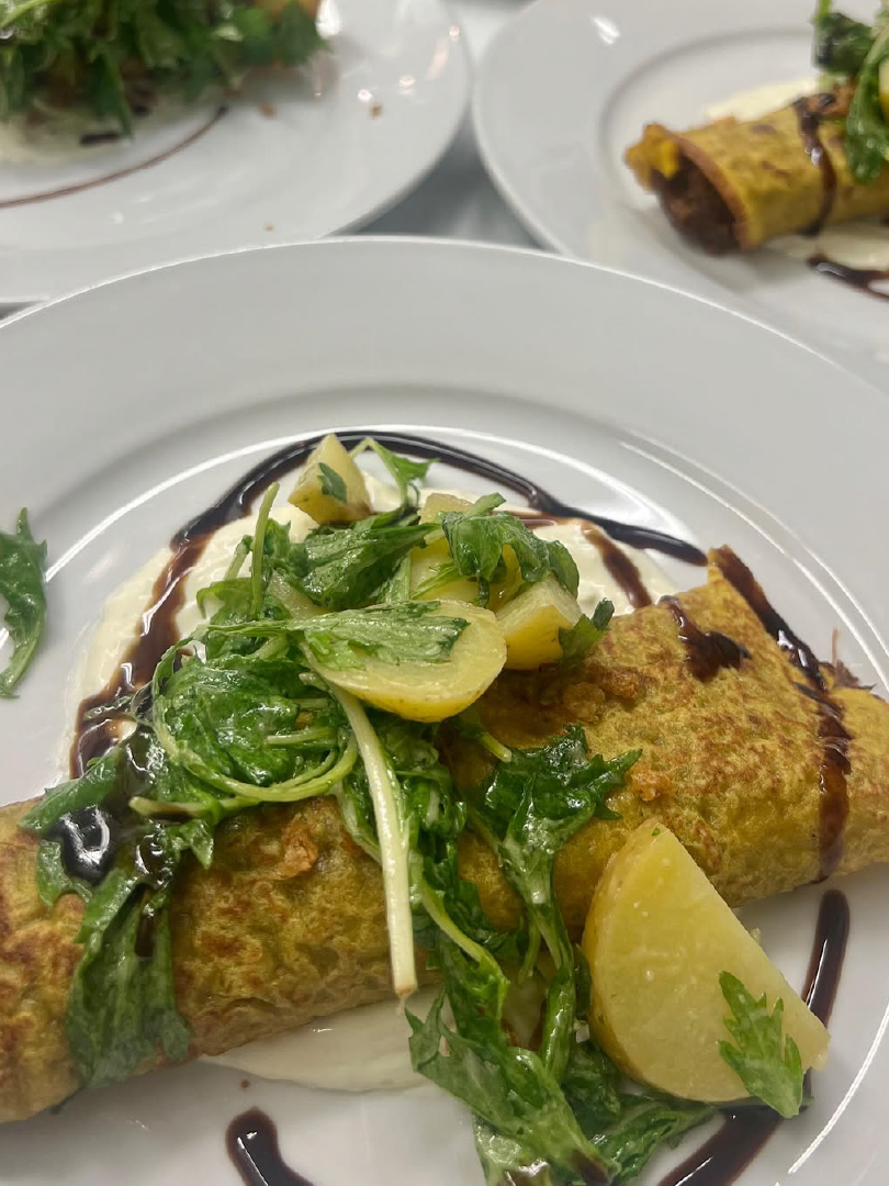 Stuffed Crepe with Greens and Lemon prepared as a Jetfinity catering selection